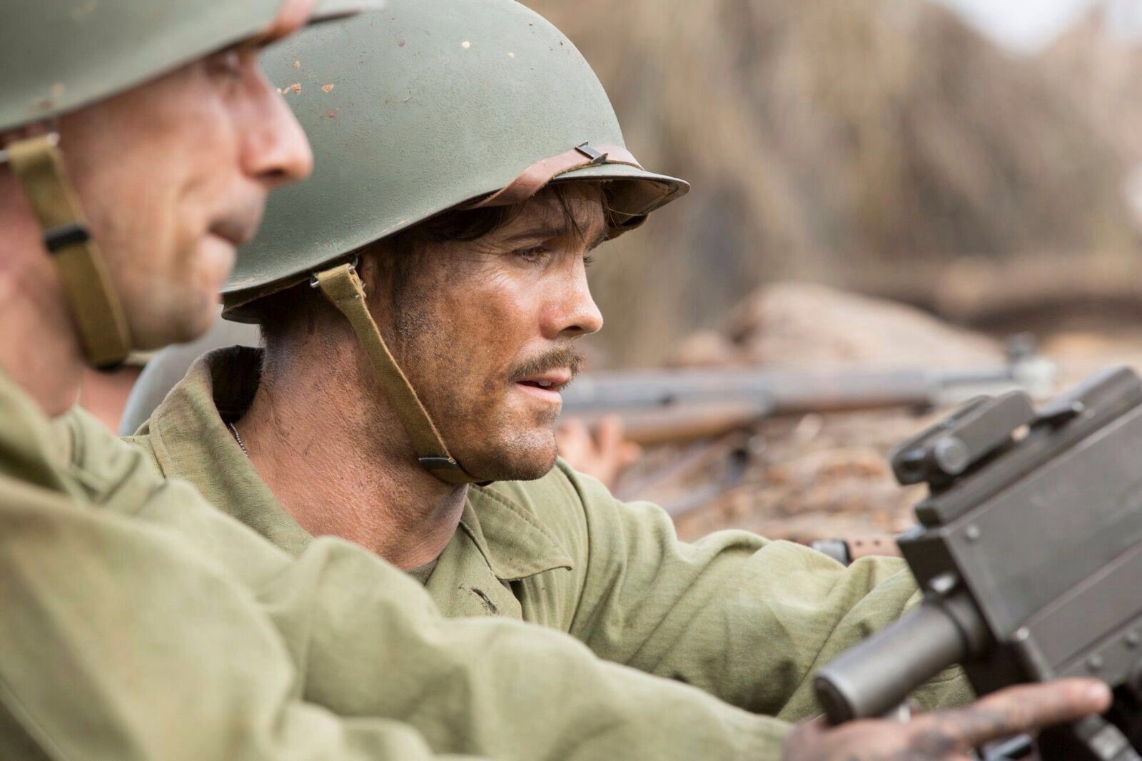 Man in army uniform in the filed. 