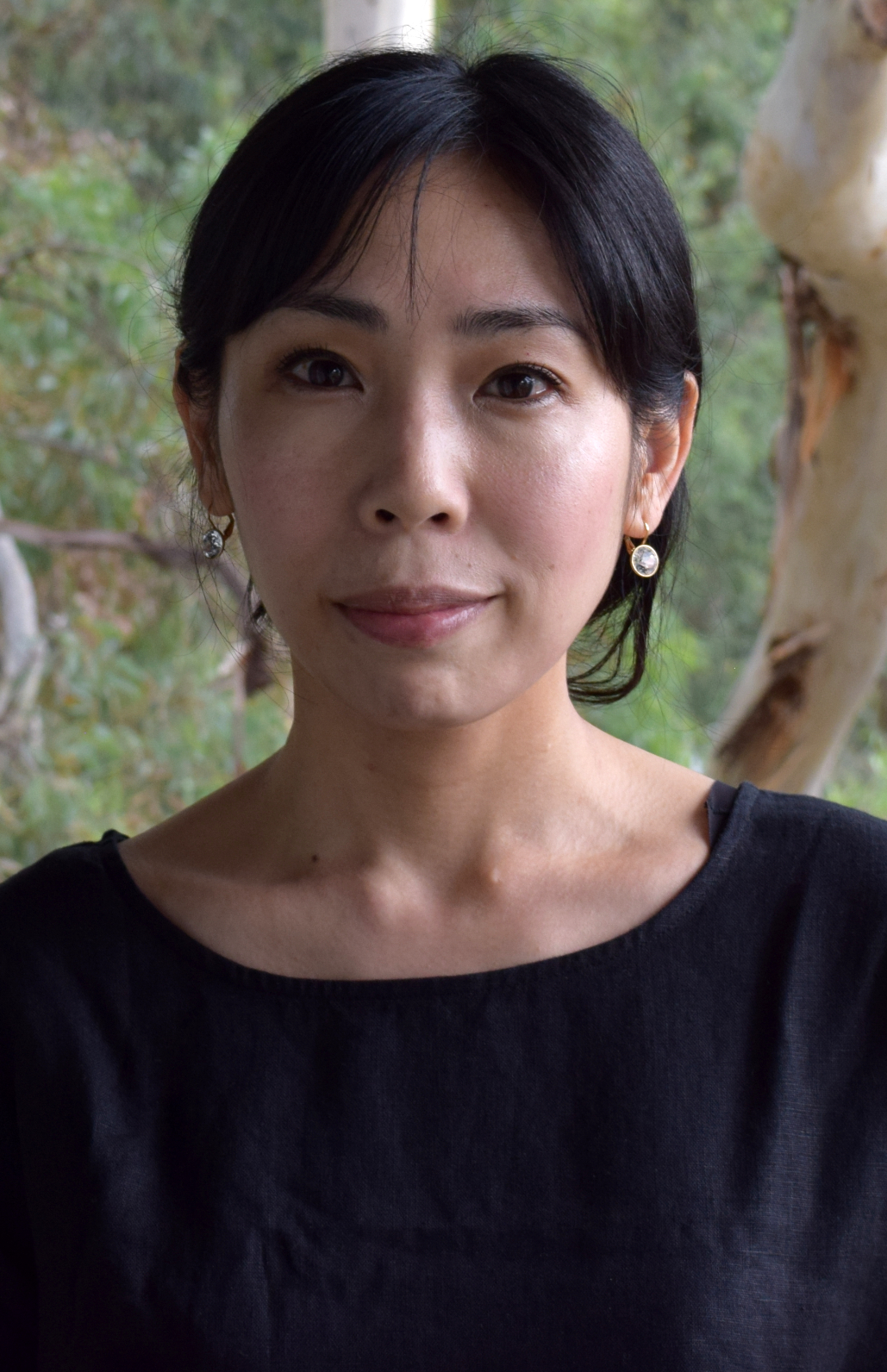 Female academic, Mai Sato in a black shirt.